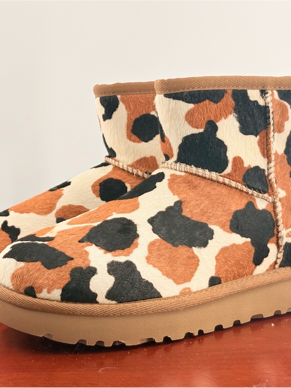 UGG  Cow-Print Short Boots in Tan, Black & Cream